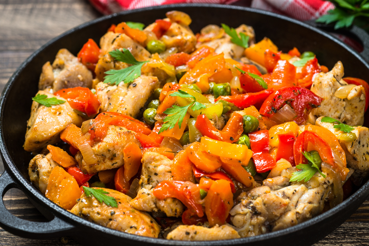 Chicken mince stir-fry with vegetables in a pan