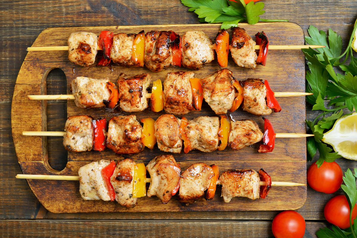 Close-up of grilled chicken tenderloins with herbs