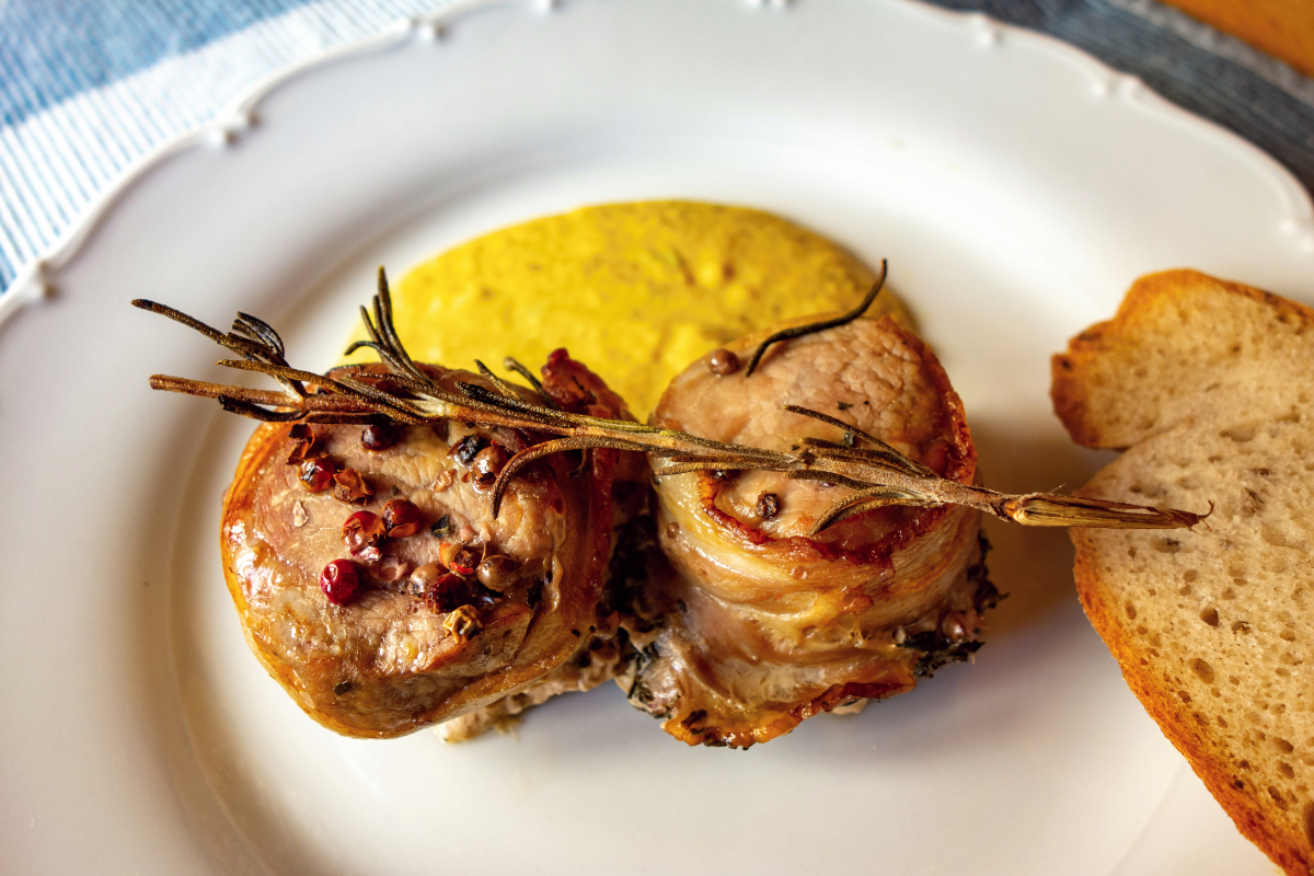 Close-up of grilled chicken tenderloins with herbs