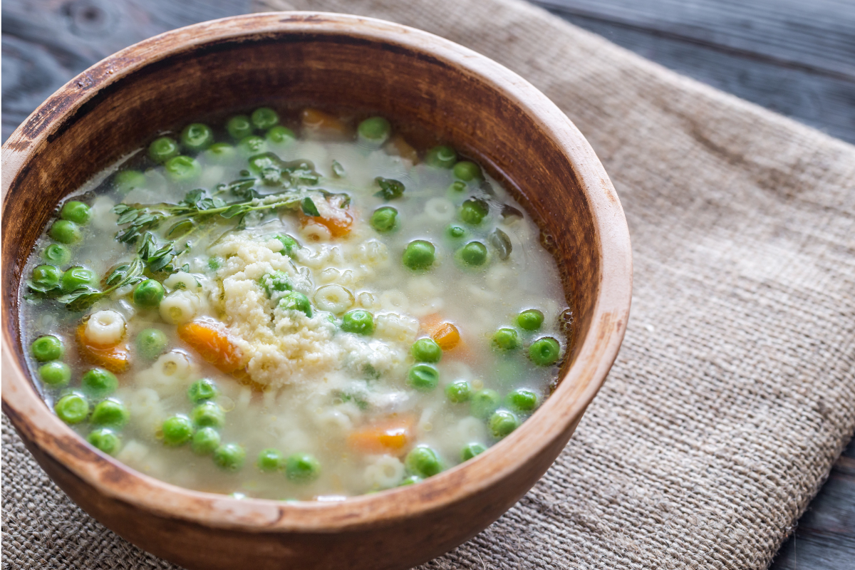 Cooked pastina in broth with herbs - Exploring Pastina: Timeless Comfort Food and Its Future in Global Cuisines