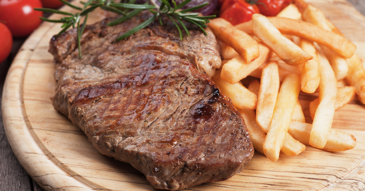 Blue steak served on a elegant plate with garnishes